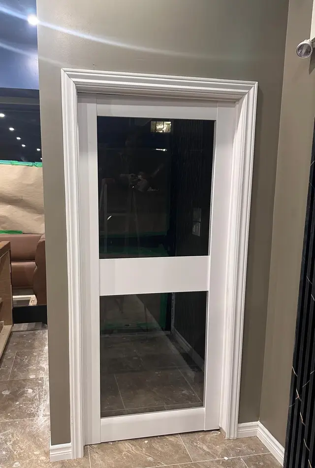 Hookah lounge buildout, build: glass door trim install