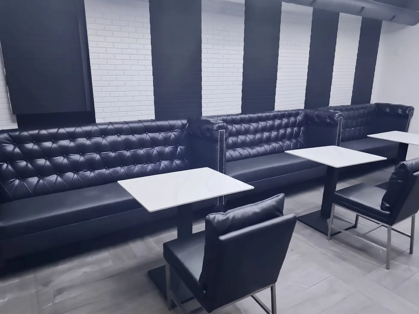 Lounge renovation, after: tufted banquette dining