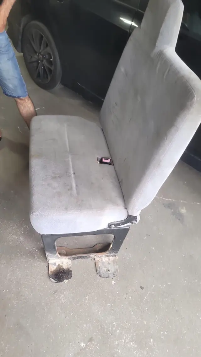 Truck cab restoration, before: worn bench seat