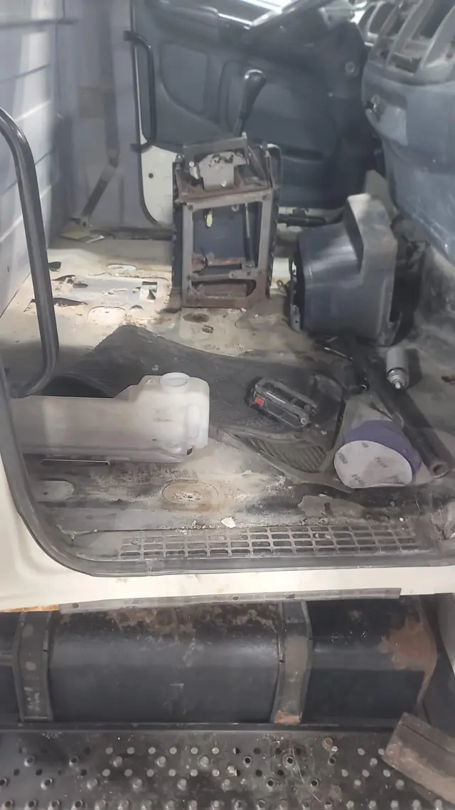 Truck cab restoration, before: rusted cab floor